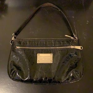 Black MK mini clutch with strap.